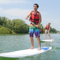 Die et le Diois 6 Camping du Lac Bleu Ciela Village couple paddle boarding on lake